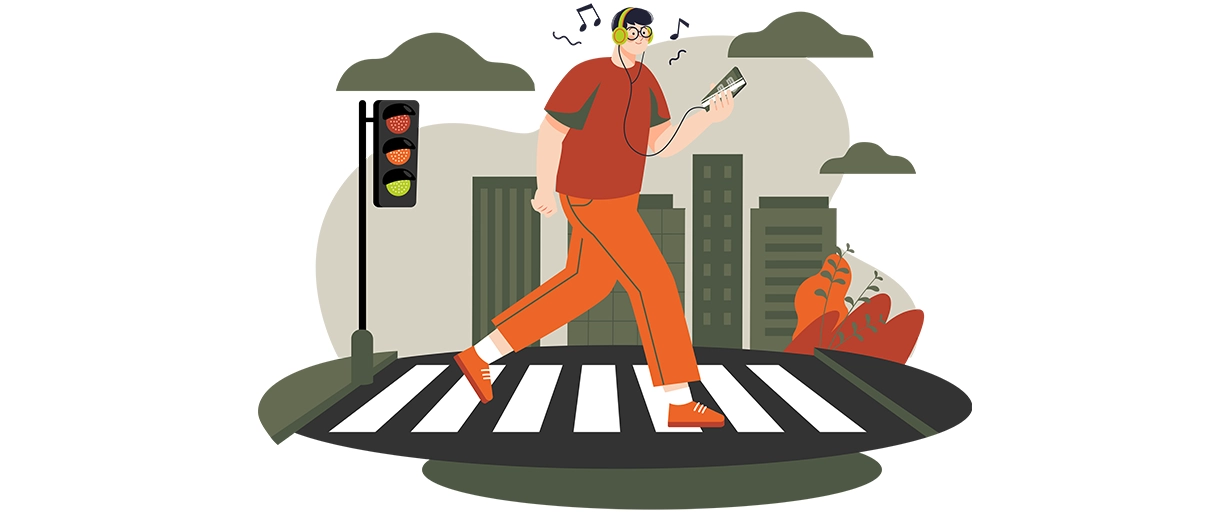 cu-casti-si-telefon-pe-trecerea-de-pietoni